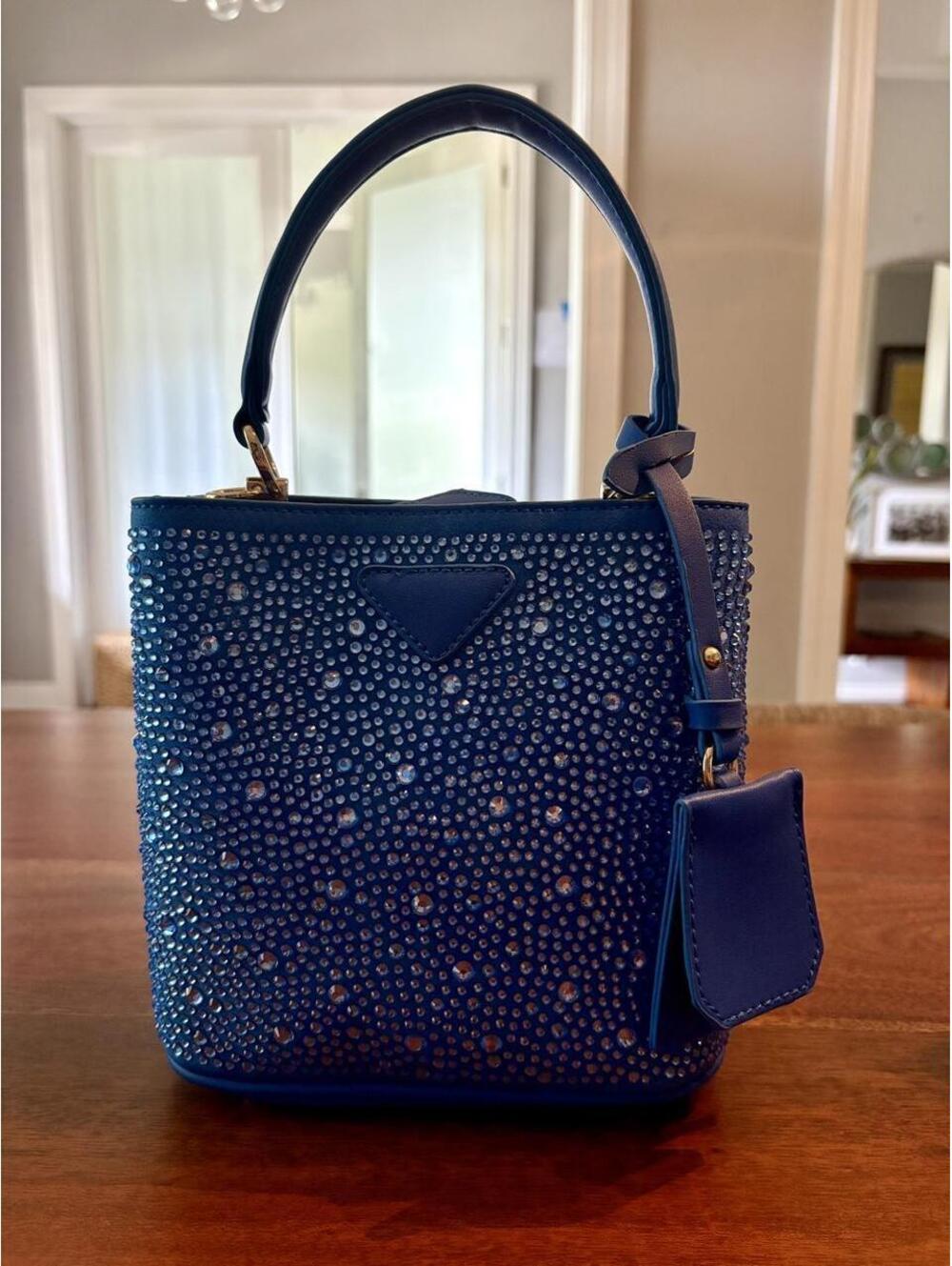 Blue leather handbag with clear studs and gold accents. NEW!